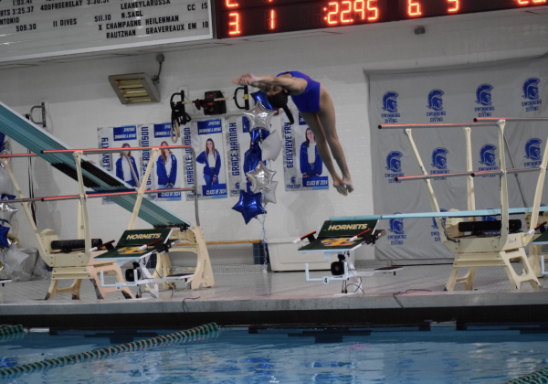 Sophomore Sonali Sareen dives into the water at the SLHS vs. Central Catholic meet. 